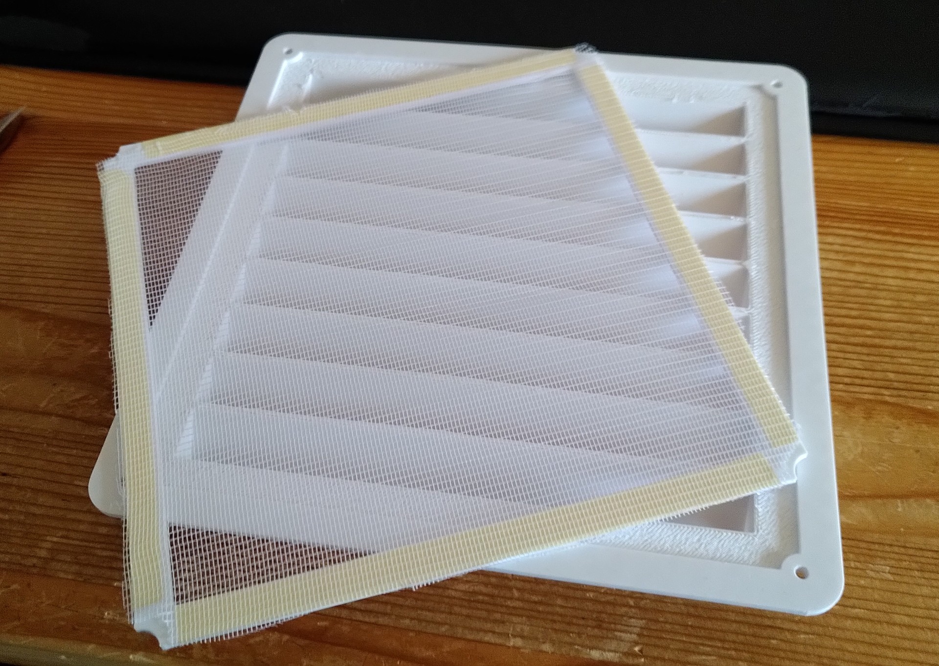 Flyscreen bonded to frame.