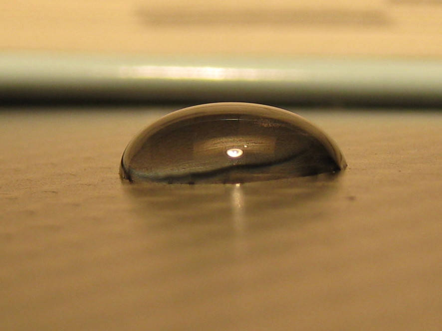 water droplet on a carbon-fiber epoxy laminate